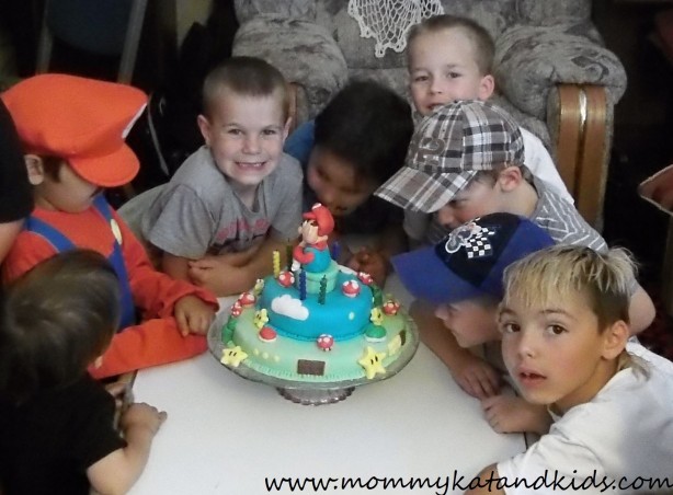 zackary and friends with his mario cake