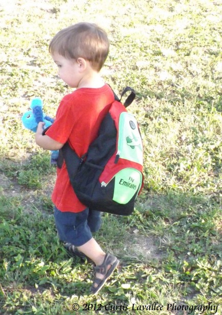boy with backpack in summer