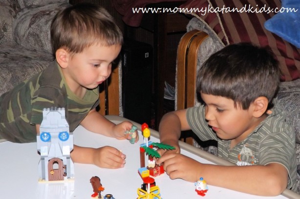 boys playing with lego spongebob set