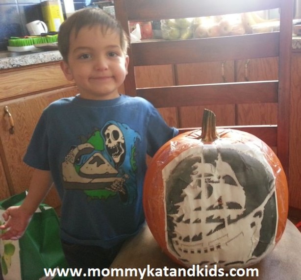 boy with halloween pumpkin