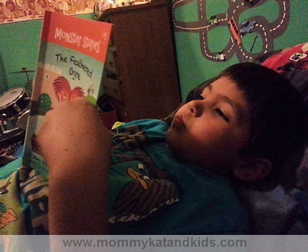 boy reading barefoot books feathered ogre