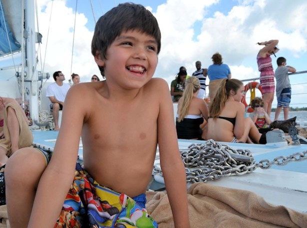 boy on beaches negril catamaran