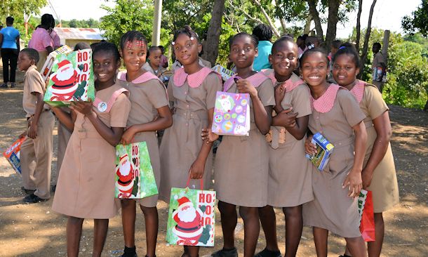 sandals foundation girls with presents