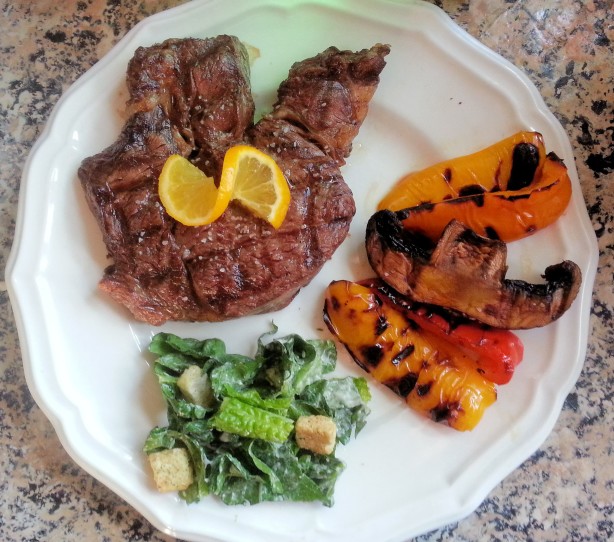steak with vegetables and salad