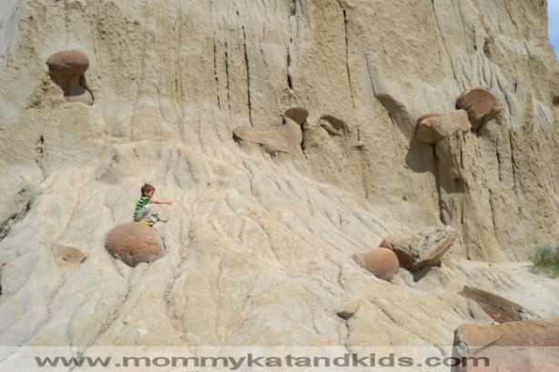 boy on rocks in north dakota badlands