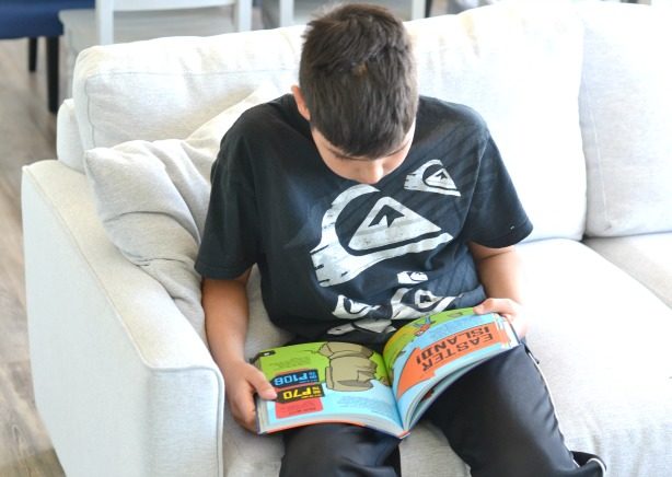 boy-reading-kids-travel-books