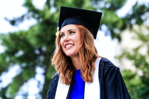 young-woman-in-graduation-gown