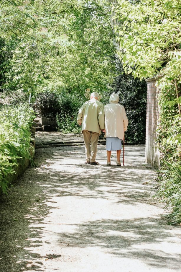 couple-walking-on-sidewalk