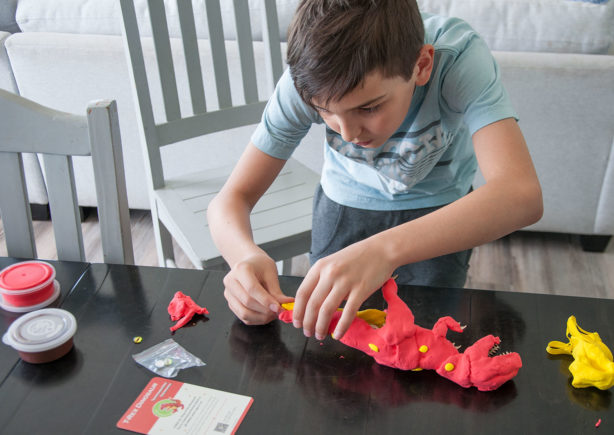 boy-making-dinosaur-puzzle