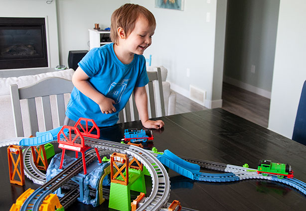 boy-playing-with-train-set