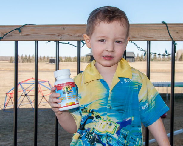 boy-holding-natures-sunshine-heroes-multivitamins