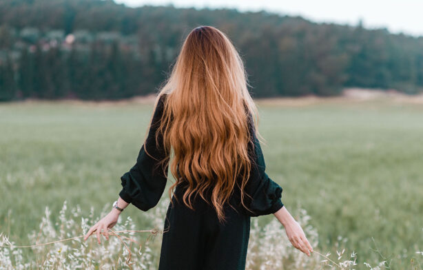 woman-with-long-hair-in-field