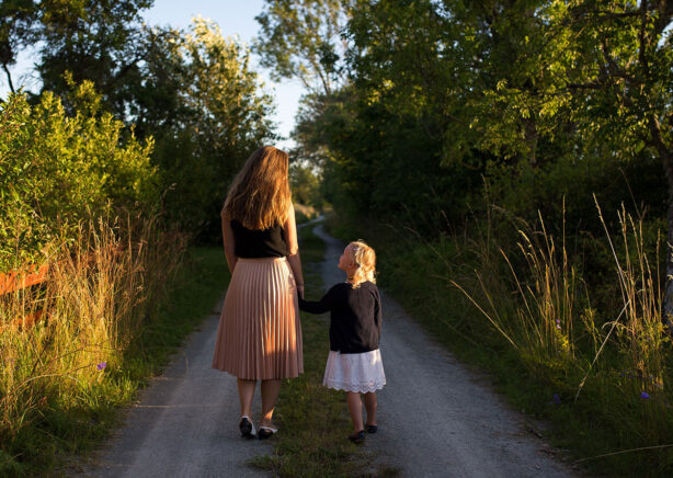 mom-and-daughter-walking-outdoors