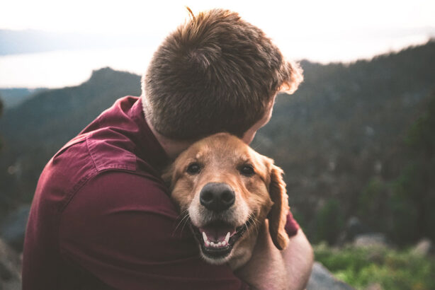 man-hugging-dog