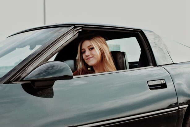 teenager sitting in car