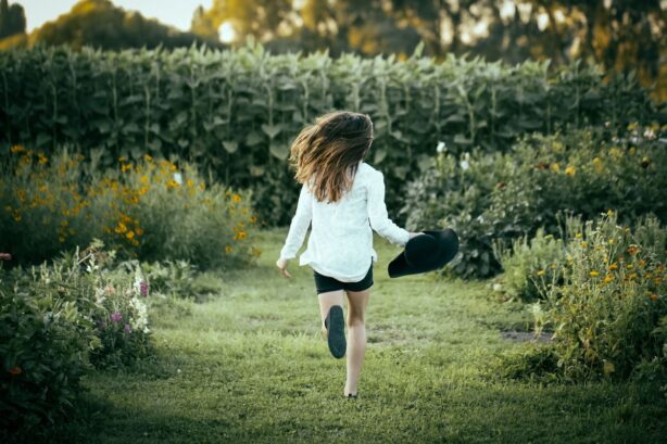 girl running in backyard