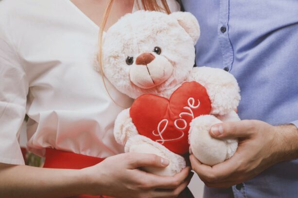 couple holding heart bear