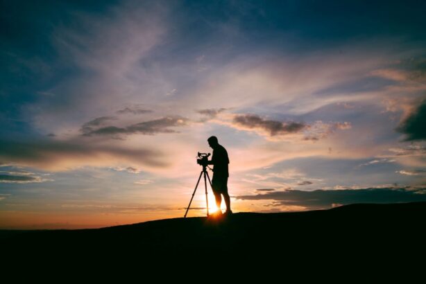 man shooting a video