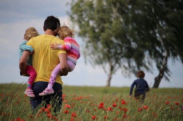 father outdoors with kids