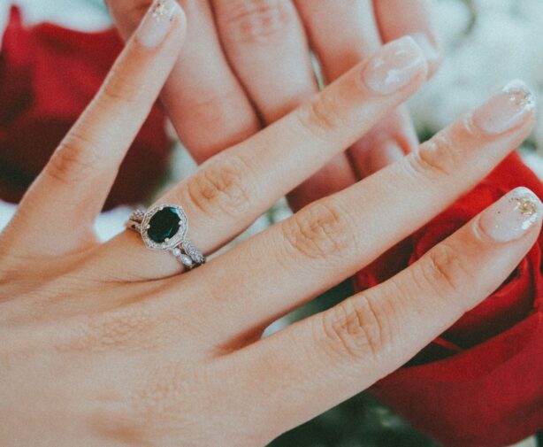 woman wearing black diamond ring