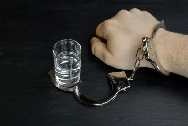 man handcuffed to vodka
