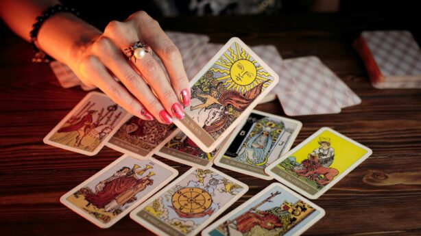hand holding tarot cards