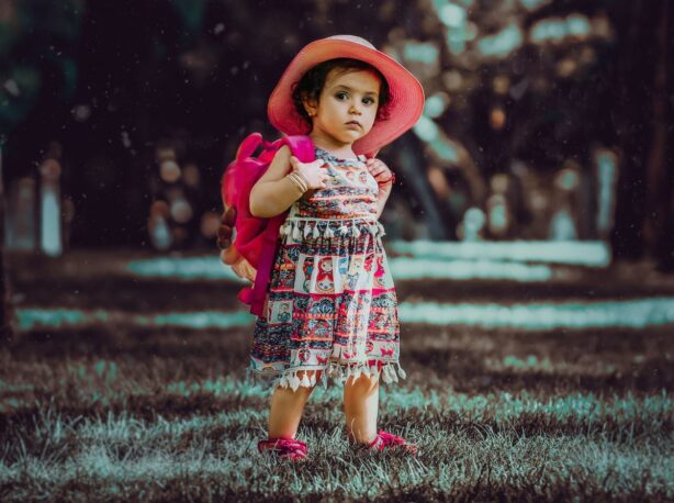 girl in fancy dress and hat