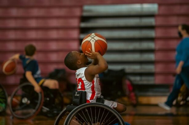 boy in wheelchair playing basketball