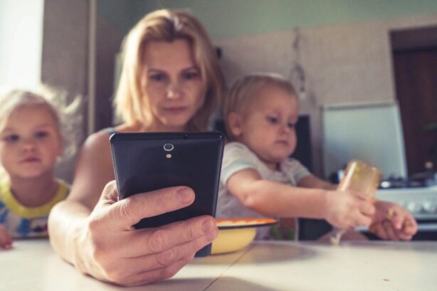 mom on phone with kids