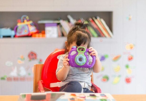 toddler playing in bedroom