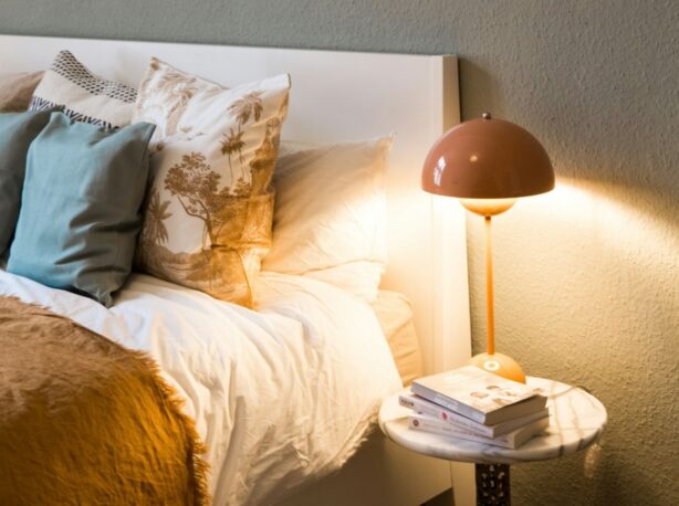 bed and nightstand with lamp
