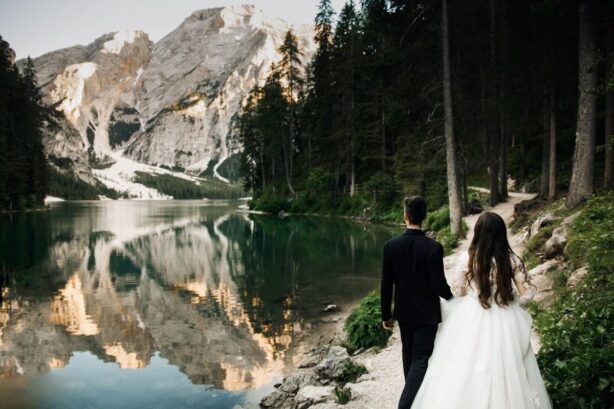 newlyweds by mountain lake