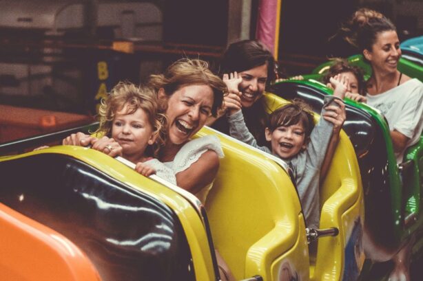 parents and children on amusement park ride