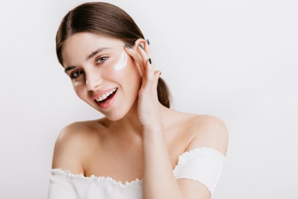 woman applying face cream