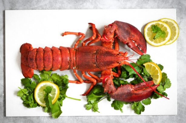 whole lobster on cutting board