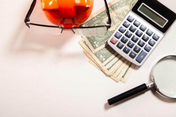 calculator and money on table