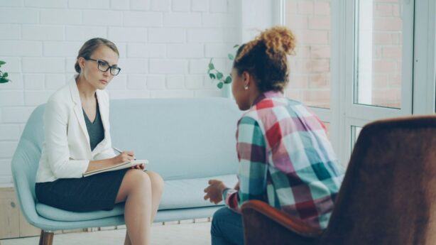 psychologist talking to woman