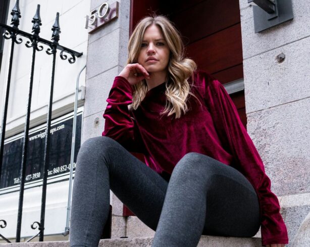 woman wearing burgundy sweater