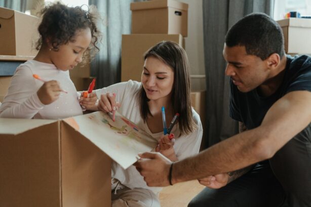 family unpacking boxes